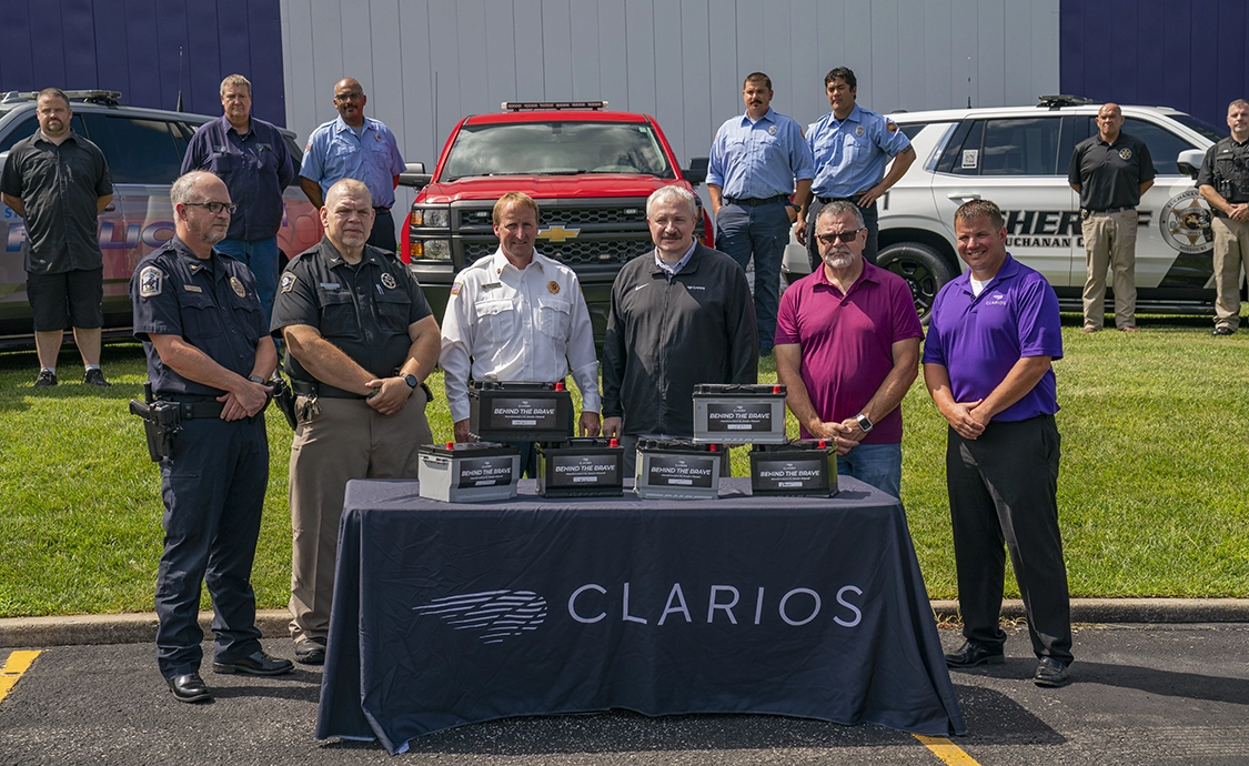 first responders posing around battery table