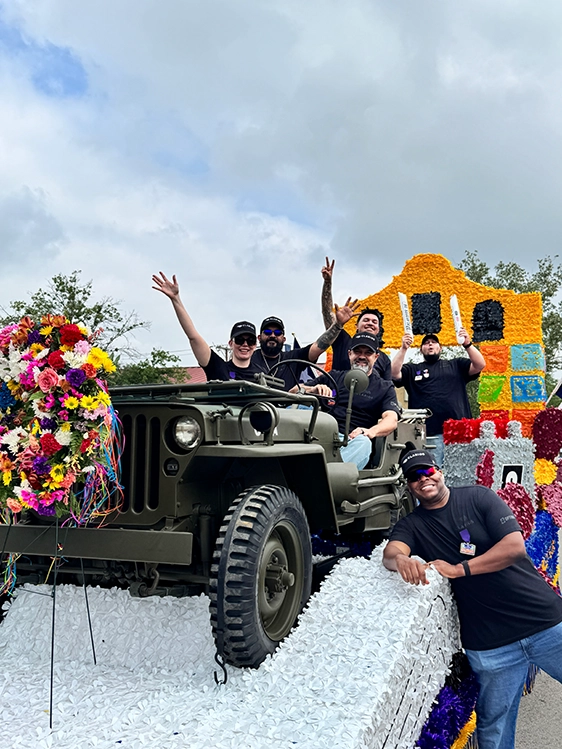 Front of Clarios float at Battle of Flowers