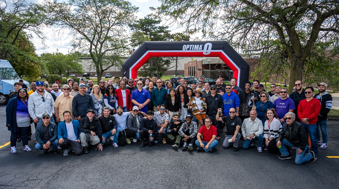 group shot of employees at Geneva 65th anniversary event