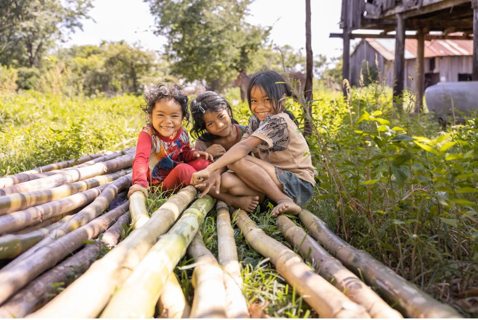 Three children smiling