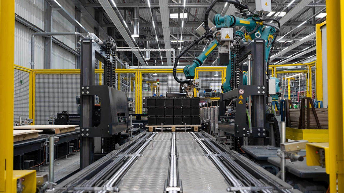 manufacturing plant conveyor with robotic arm