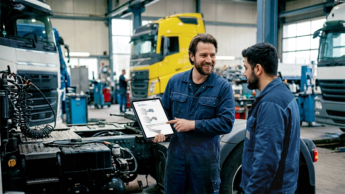 truck mechanics sharing details on ipad